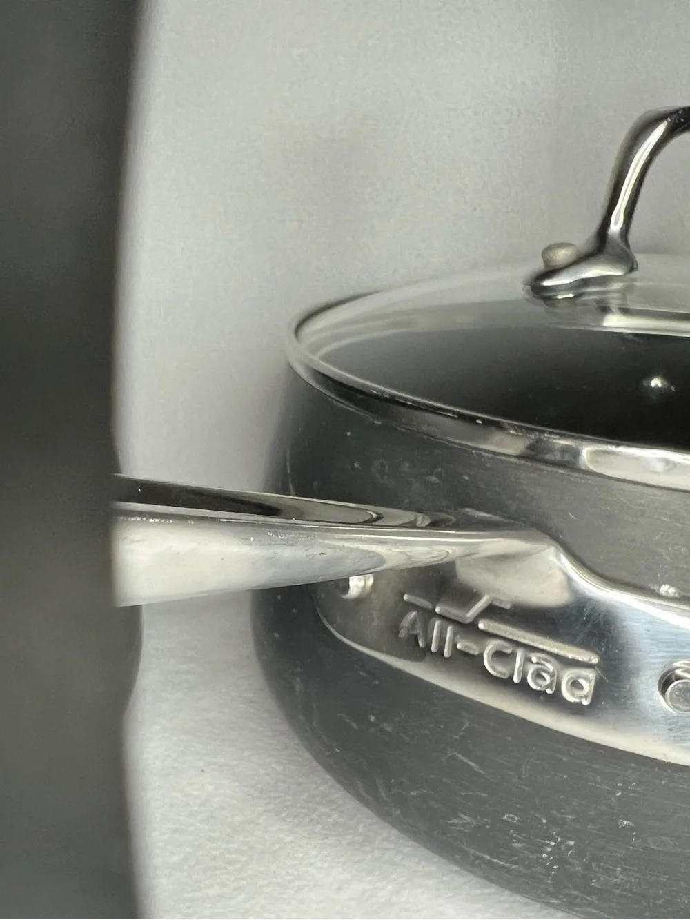 All-Clad hard-anodized nonstick saucepans, with the 2.5-qt and 3.5-qt set 1 lid
